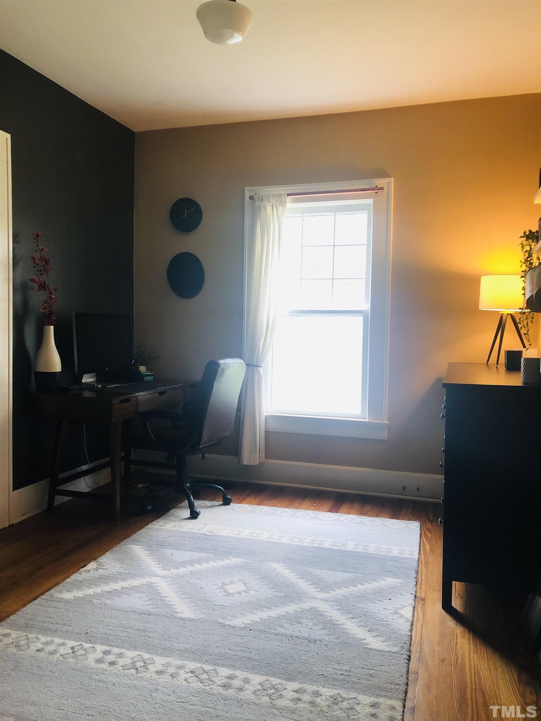 615 Milton Road Durham, NC 27712 - Photo 17 of 36 a living room with furniture and a window