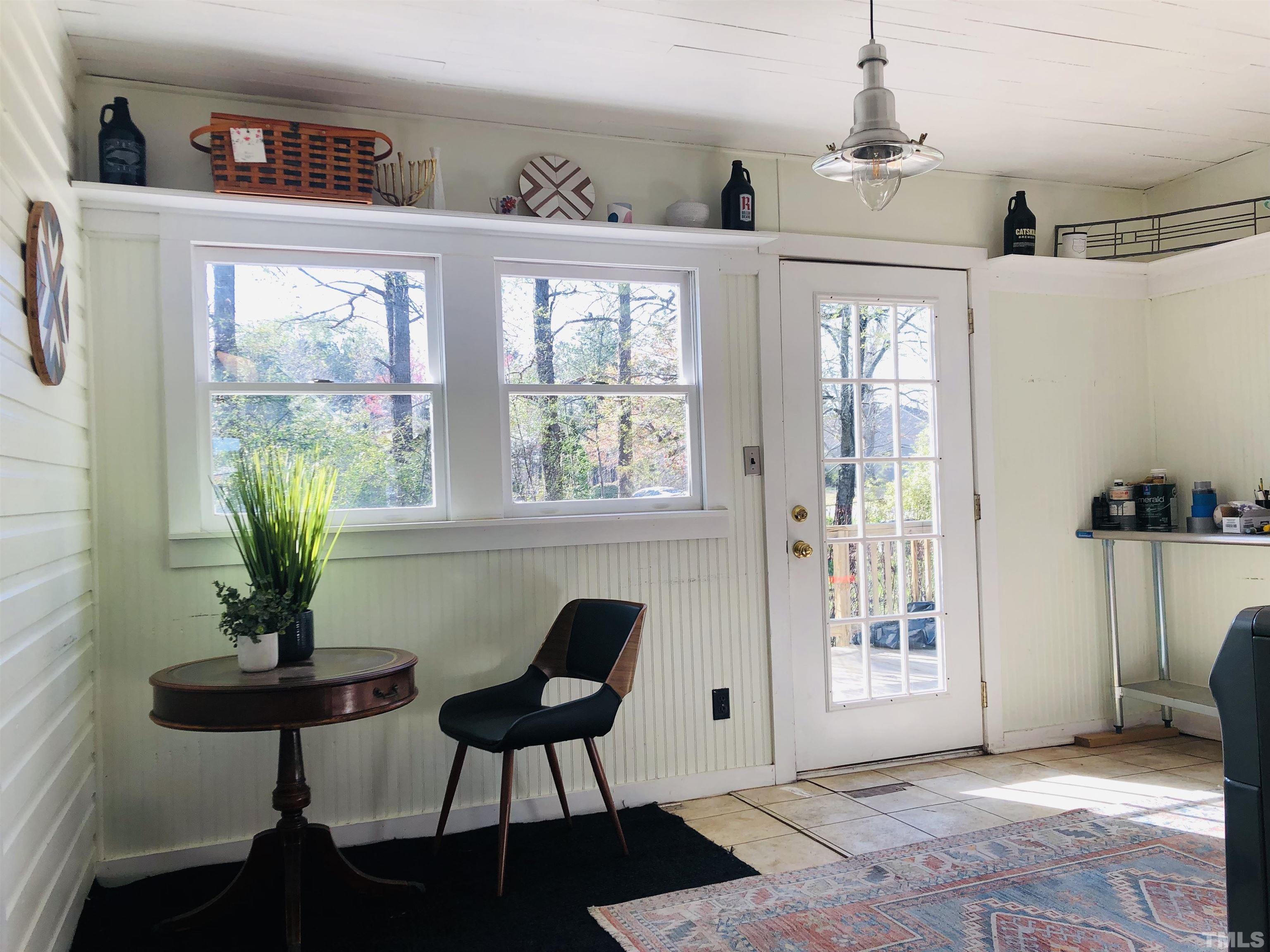 615 Milton Road Durham, NC 27712 - Photo 20 of 36 a living room with furniture and a window