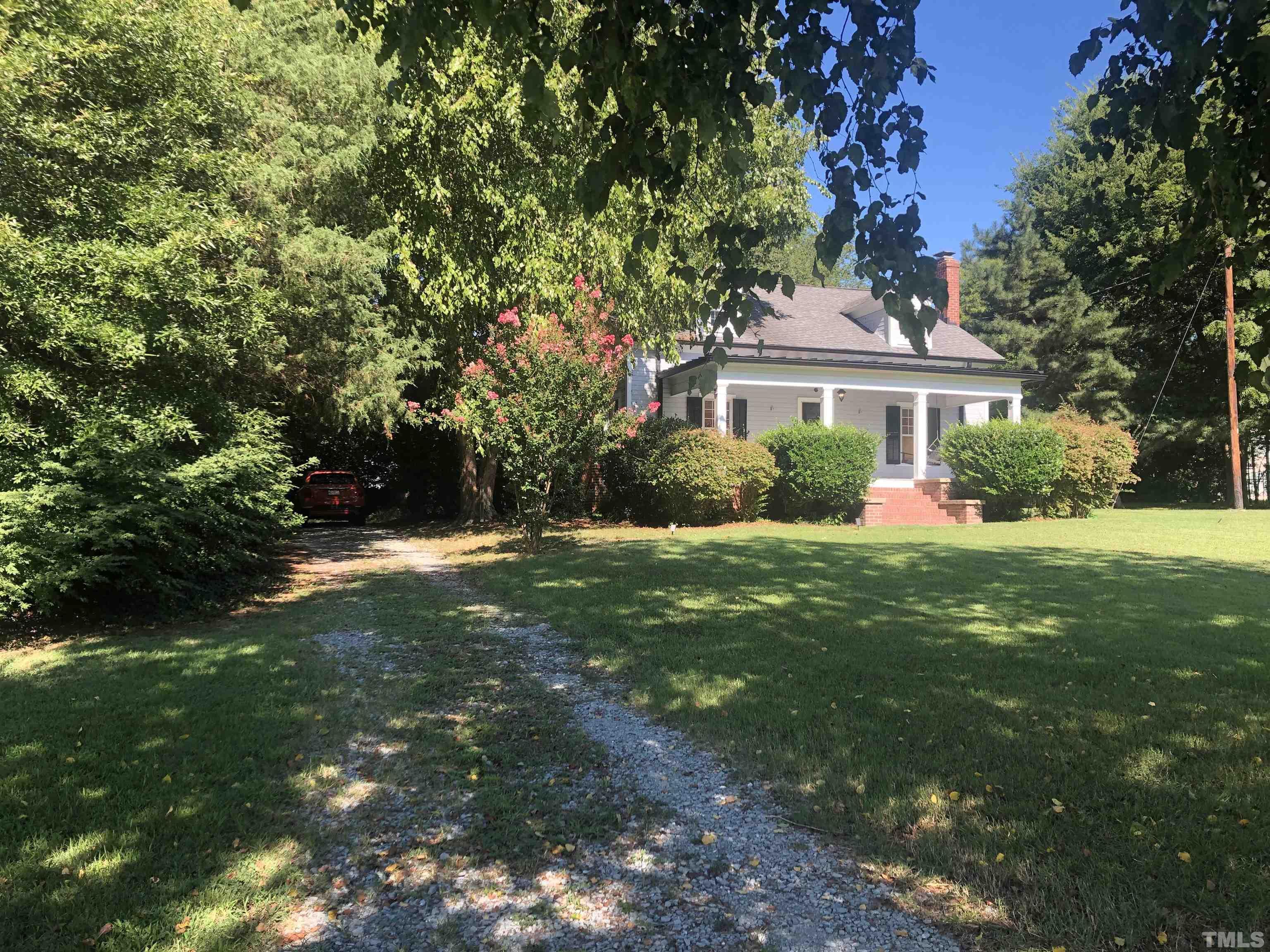 615 Milton Road Durham, NC 27712 - Photo 2 of 36 a front view of house with yard and green space