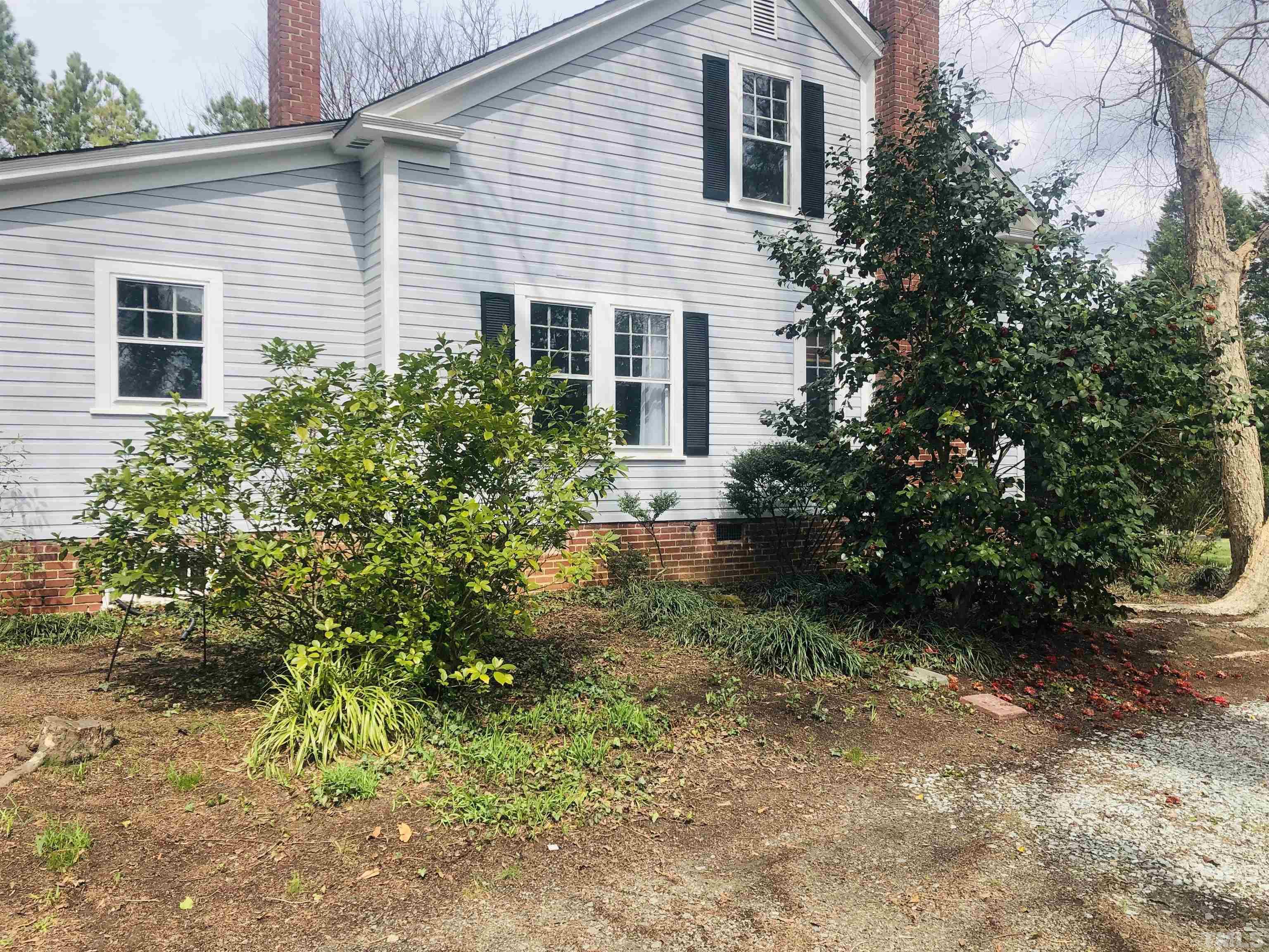 615 Milton Road Durham, NC 27712 - Photo 29 of 36 a view of a house with a yard and plants