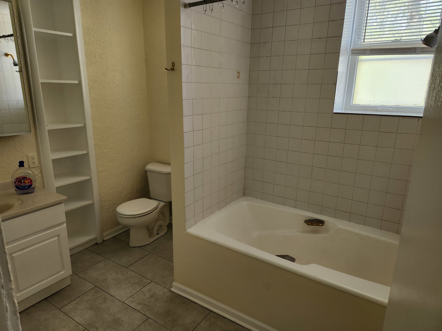 2224 West Irving Park Road, Unit 2 Chicago, IL 60618 - Photo 7 of 11 a white bath tub sitting next to a white toilet
