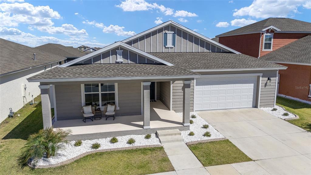 a front view of house with yard outdoor seating and barbeque oven