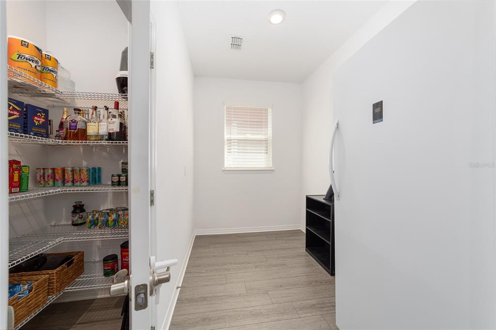 7233 Southwest 64th St Road Ocala, FL 34474 - Photo 12 of 48 a view of kitchen and wooden floor