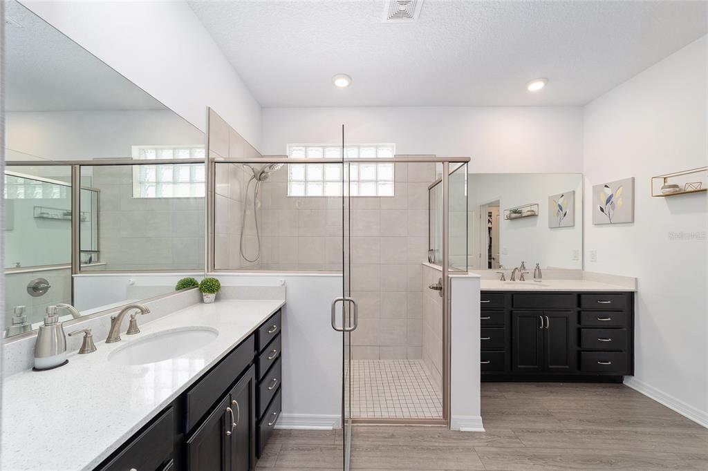 7233 Southwest 64th St Road Ocala, FL 34474 - Photo 23 of 48 a bathroom with a tub sink and mirror