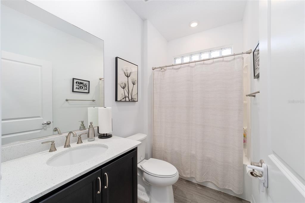 7233 Southwest 64th St Road Ocala, FL 34474 - Photo 32 of 48 a bathroom with a sink toilet and vanity