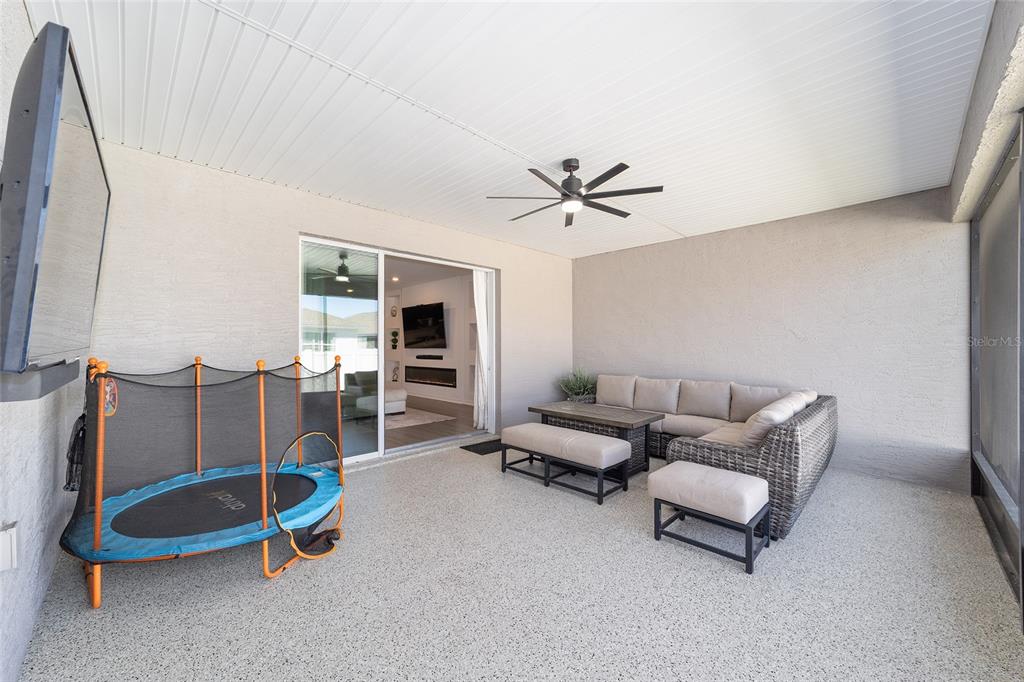 7233 Southwest 64th St Road Ocala, FL 34474 - Photo 36 of 48 a living room with furniture and a wooden floor