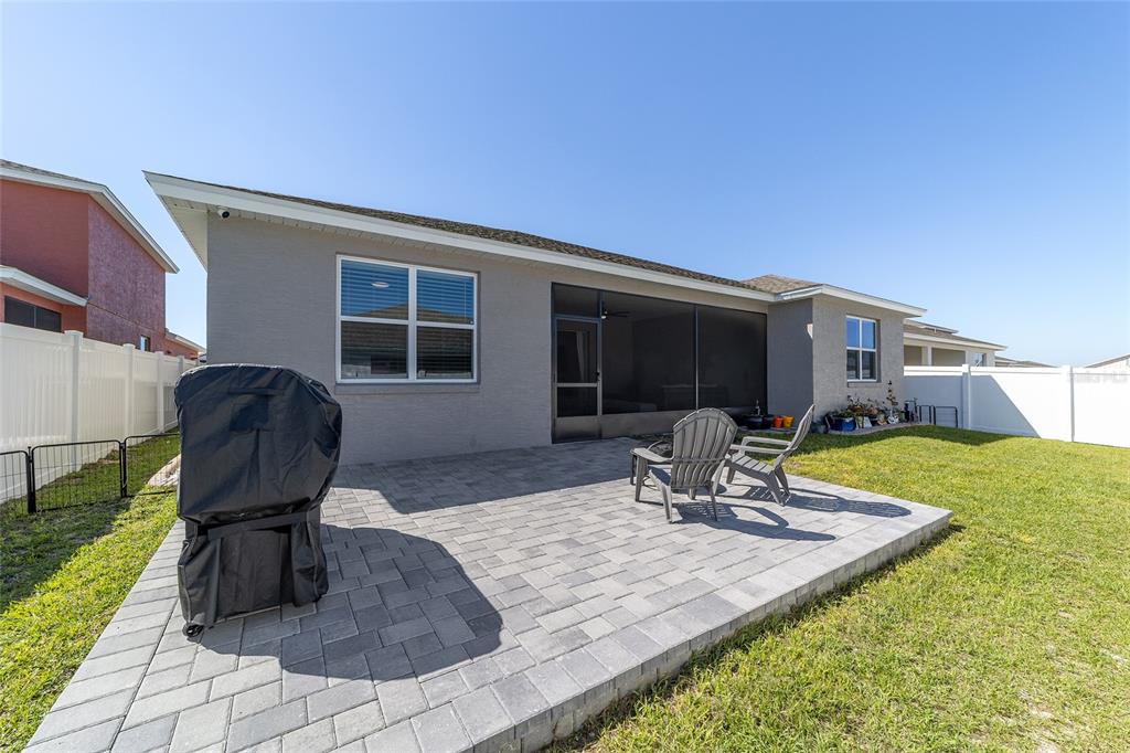 7233 Southwest 64th St Road Ocala, FL 34474 - Photo 38 of 48 a view of a house with backyard sitting area and furniture
