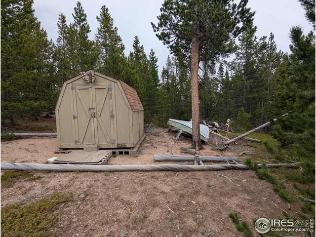 a view of a barn in a yard