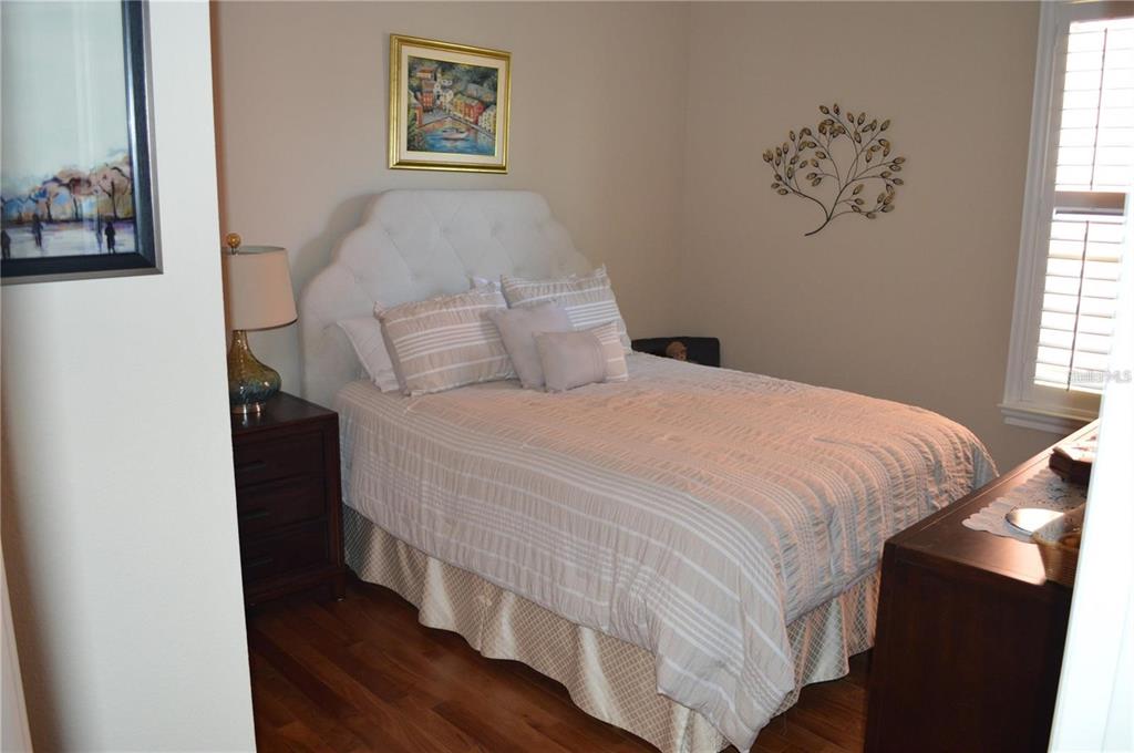 32026 Wenlock Loop Wesley Chapel, FL 33543 - Photo 25 of 52 a bedroom with a bed and a window