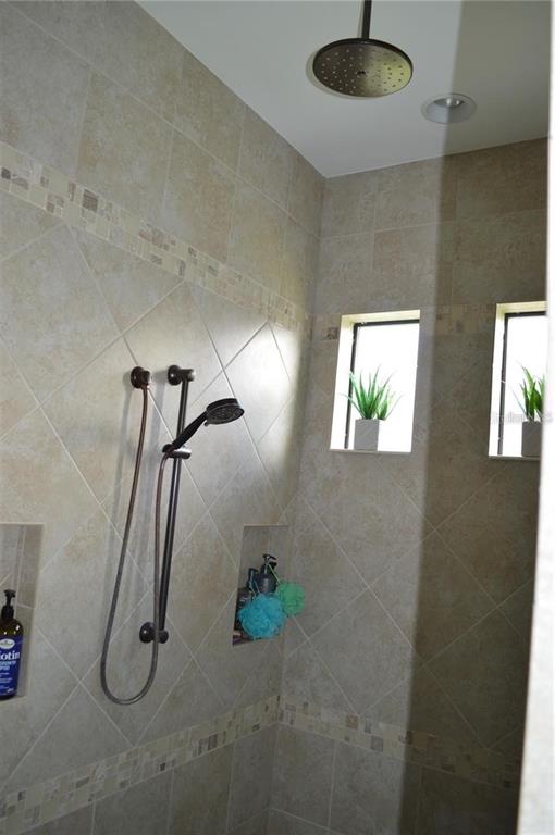 32026 Wenlock Loop Wesley Chapel, FL 33543 - Photo 39 of 52 a bathroom with a shower