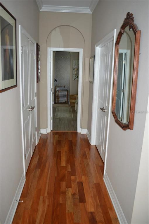 32026 Wenlock Loop Wesley Chapel, FL 33543 - Photo 46 of 52 a view of a hallway view with wooden floor and staircase