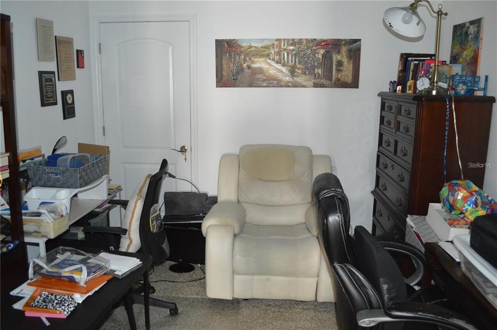32026 Wenlock Loop Wesley Chapel, FL 33543 - Photo 47 of 52 a living room with furniture and a flat screen tv