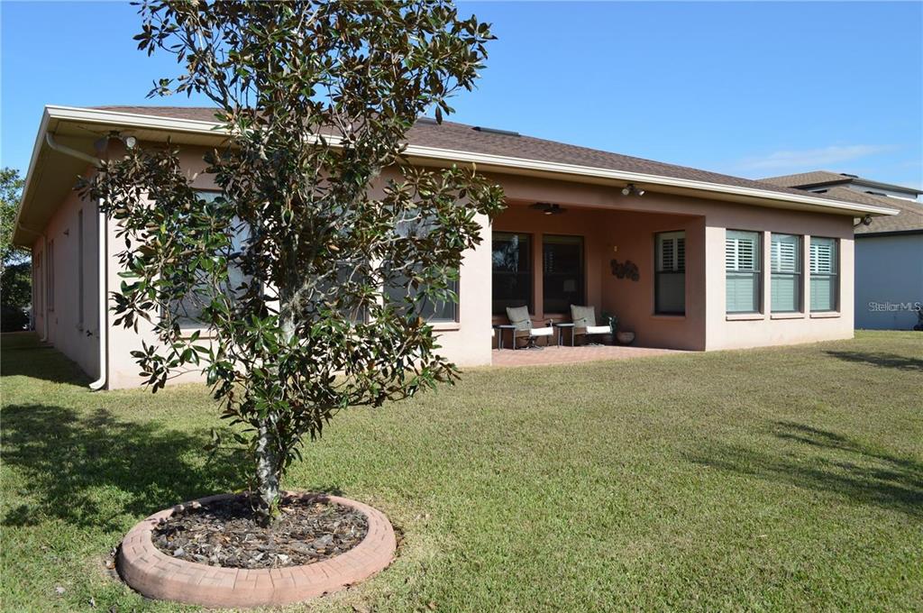 32026 Wenlock Loop Wesley Chapel, FL 33543 - Photo 49 of 52 a view of a house with a porch