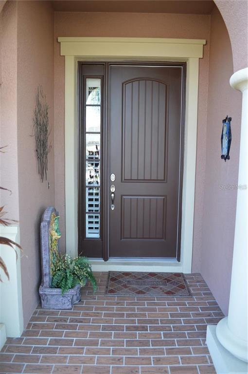 32026 Wenlock Loop Wesley Chapel, FL 33543 - Photo 7 of 52 a front view of a house