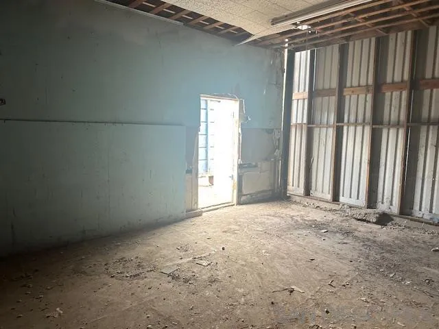 900 East 3rd Street Calexico, CA 92231 - Photo 9 of 13 an empty room with windows