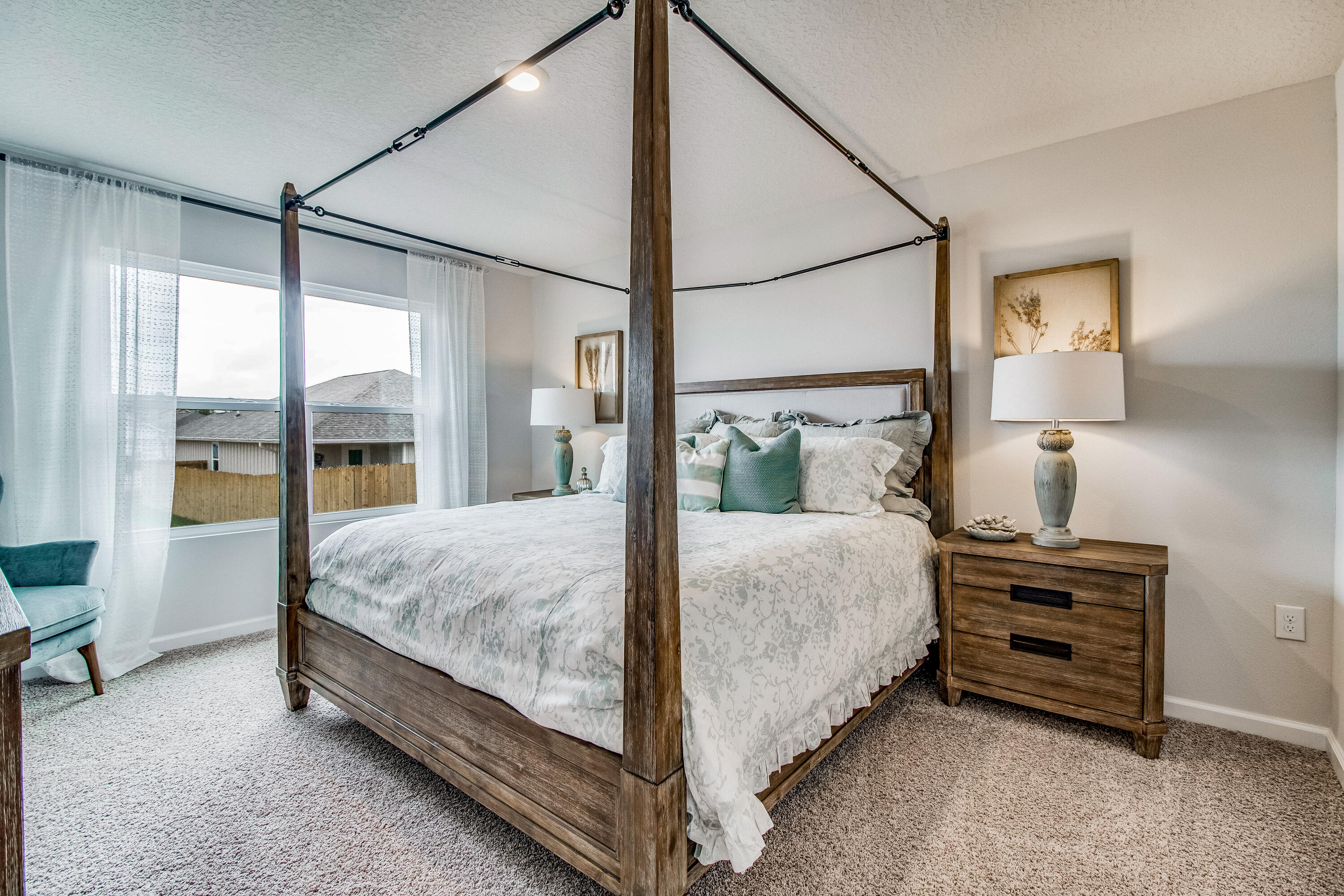 6822 Interlachen Lane Laurel Hill, FL 32567 - Photo 12 of 27 a bed sitting in a bedroom next to a window