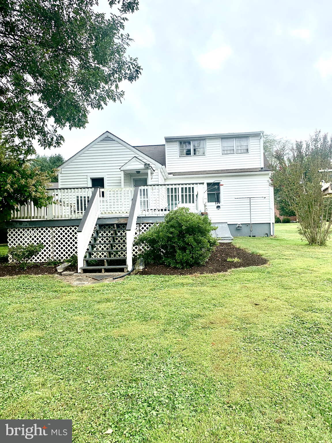 832 Evanson Road Hockessin, DE 19707 - Photo 3 of 13 a view of a house with a yard and trees