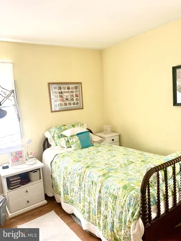 a bed room with a bed and a dresser