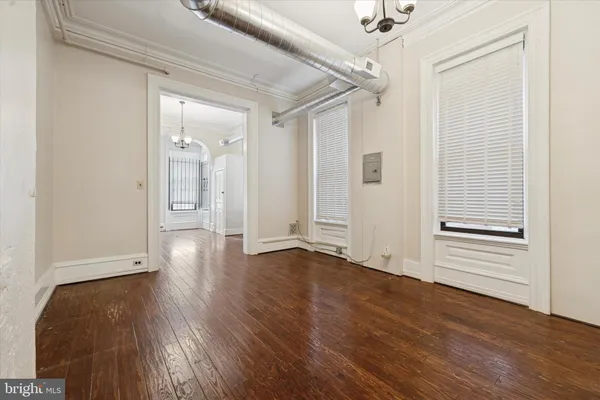 a view of a livingroom with wooden floor