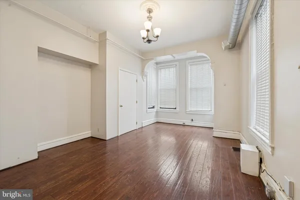 a view of a livingroom with wooden floor
