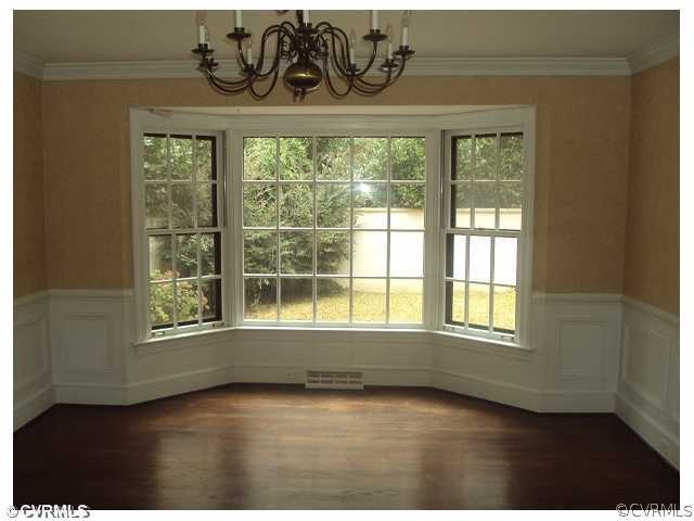9320 Ramsgate Lane Chesterfield, VA 23236 - Photo 4 of 6 an empty room with wooden floor and windows