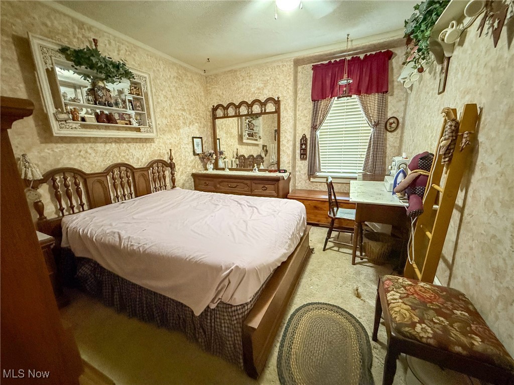 1667 County Road Dillonvale, OH 43917 - Photo 27 of 35 Bedroom featuring ornamental molding and wallpapered walls