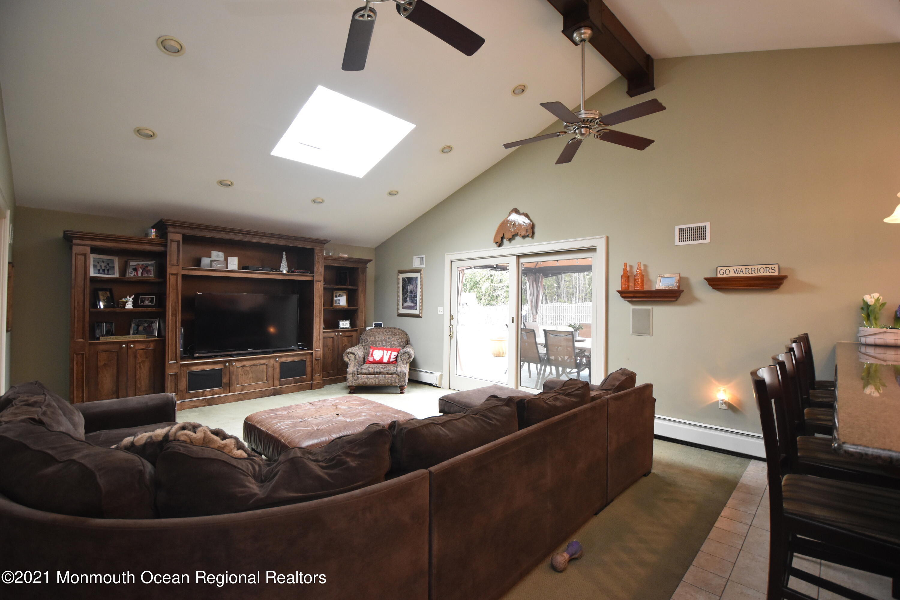 1007 Cedar Lane Brielle, NJ 08730 - Photo 13 of 46 a living room with furniture and a flat screen tv