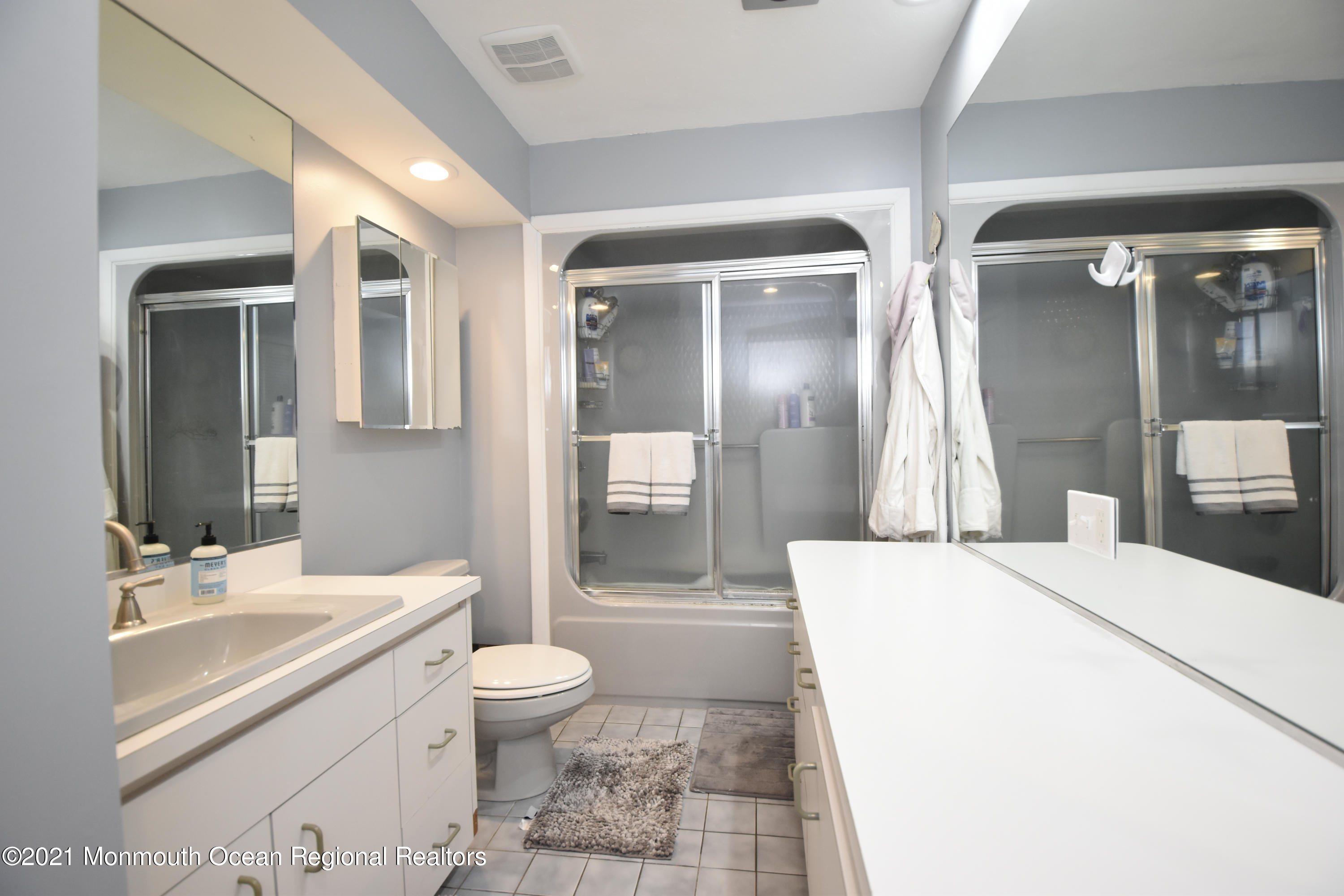 1007 Cedar Lane Brielle, NJ 08730 - Photo 24 of 46 a bathroom with a double vanity sink toilet and shower