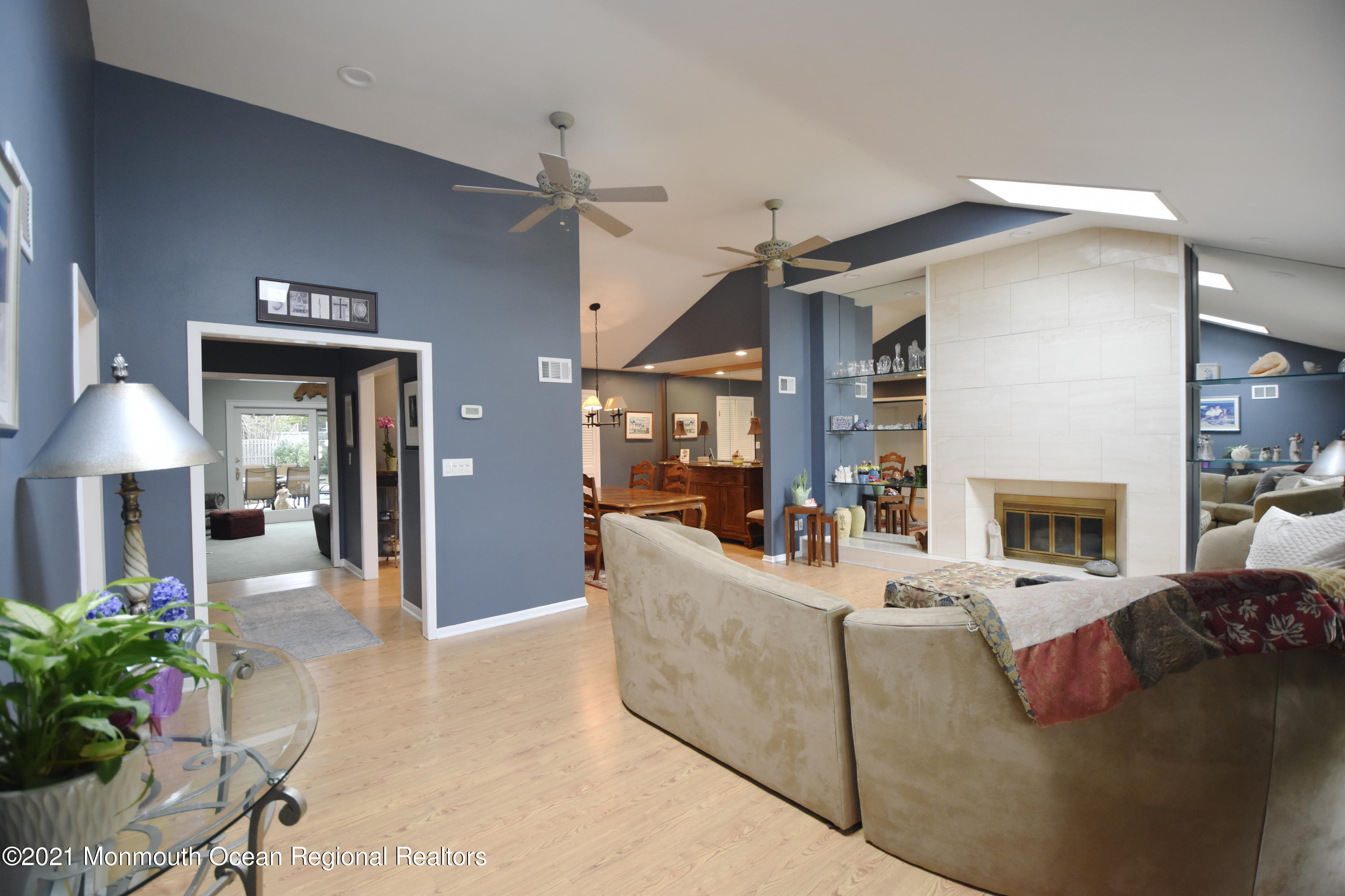 1007 Cedar Lane Brielle, NJ 08730 - Photo 4 of 46 a living room with furniture a fireplace and a potted plant