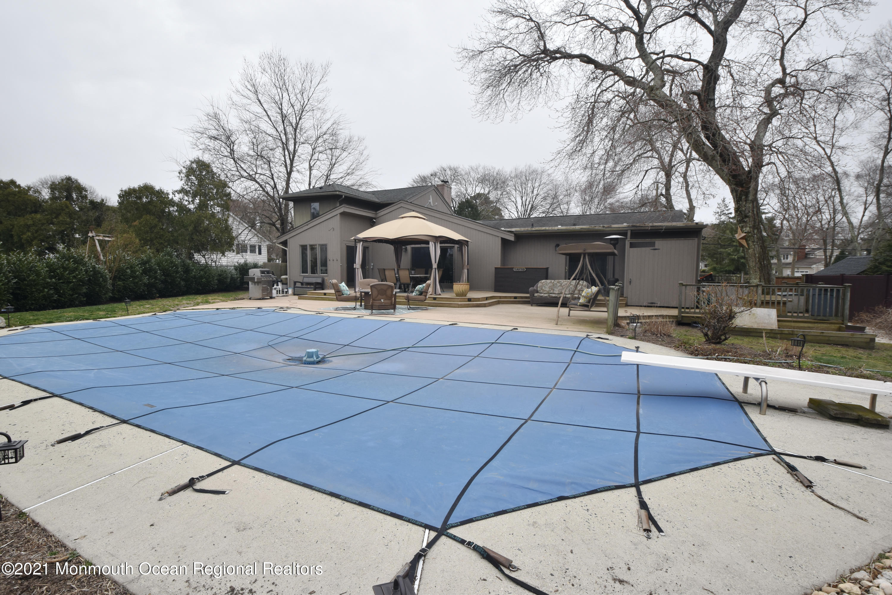1007 Cedar Lane Brielle, NJ 08730 - Photo 41 of 46 a house that has a tree in front of it