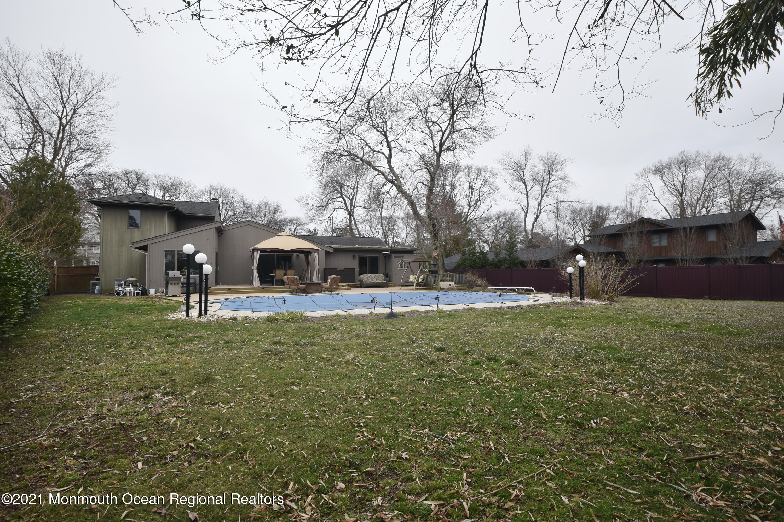 1007 Cedar Lane Brielle, NJ 08730 - Photo 42 of 46 a front view of a house with a garden