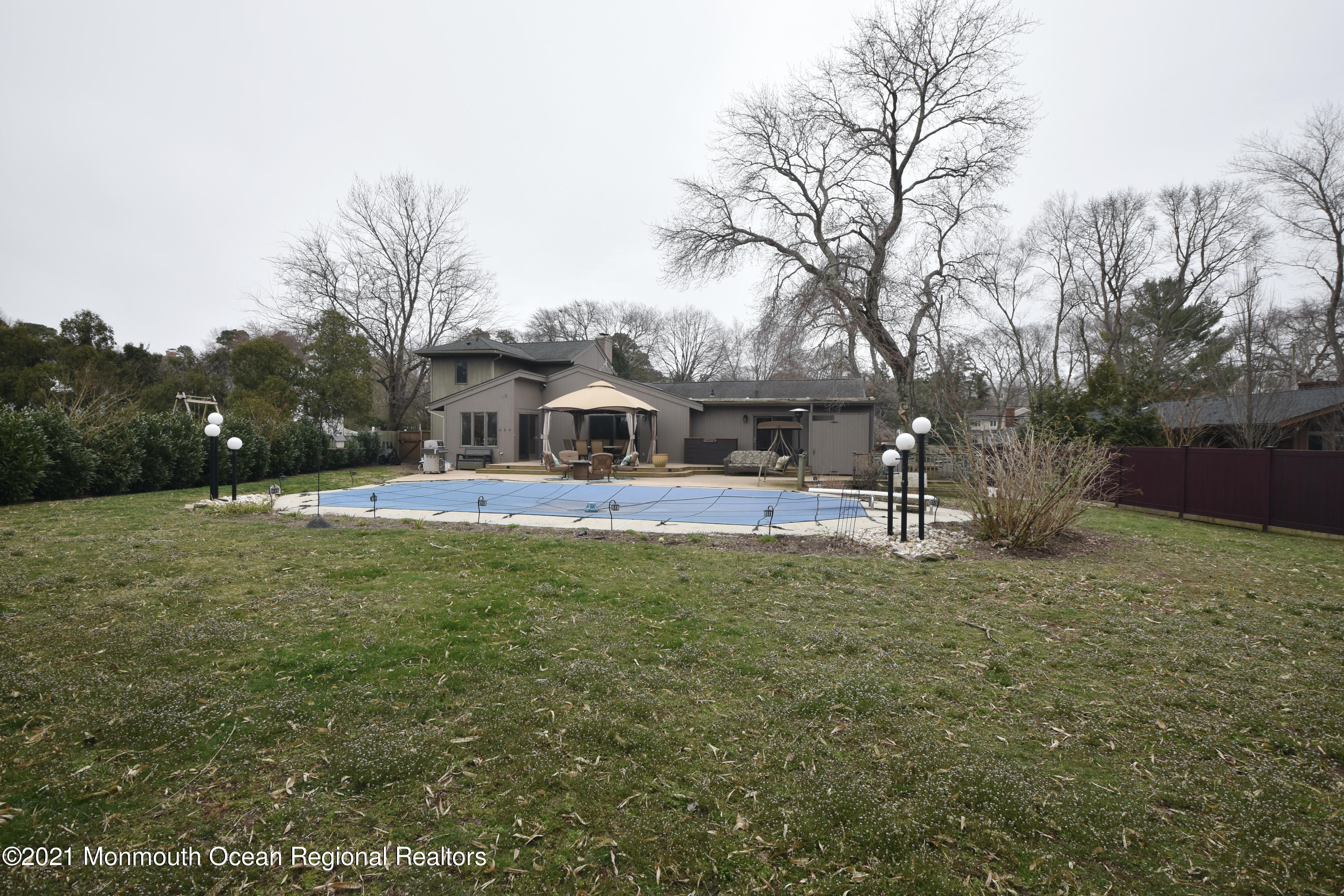 1007 Cedar Lane Brielle, NJ 08730 - Photo 43 of 46 a front view of a house with garden