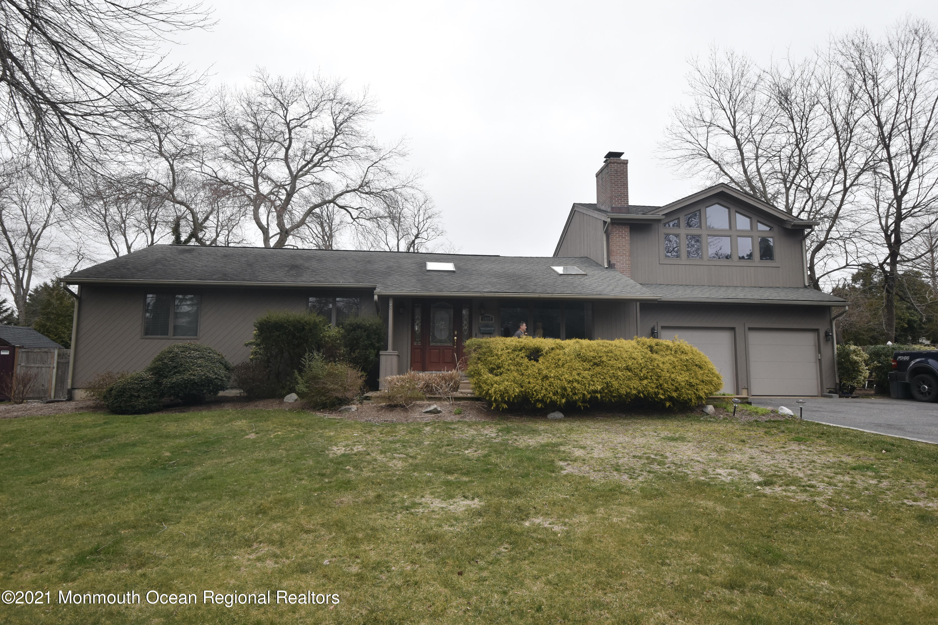 1007 Cedar Lane Brielle, NJ 08730 - Photo 46 of 46 a view of a house with a yard and large tree