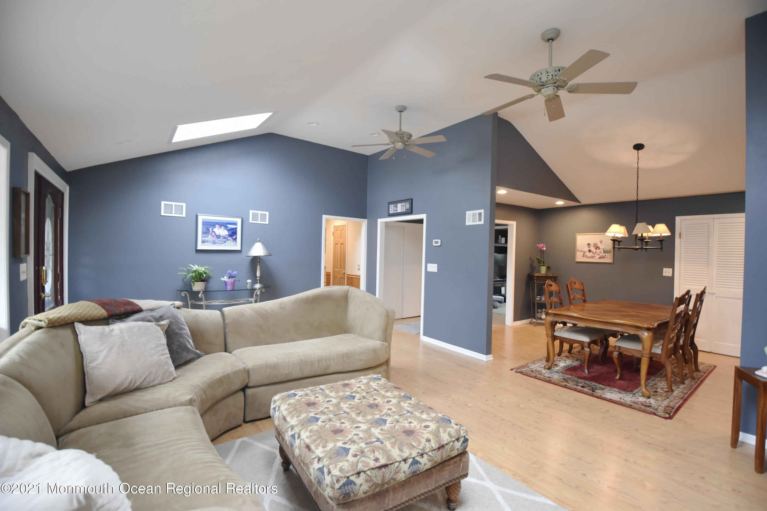 1007 Cedar Lane Brielle, NJ 08730 - Photo 6 of 46 a living room with furniture and a chandelier