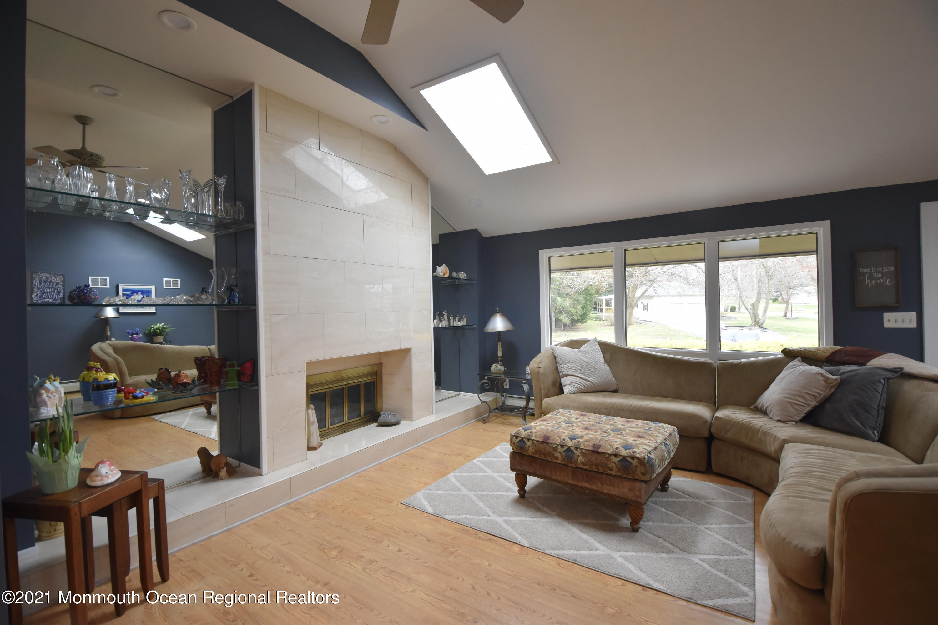1007 Cedar Lane Brielle, NJ 08730 - Photo 7 of 46 a living room with furniture and a fireplace