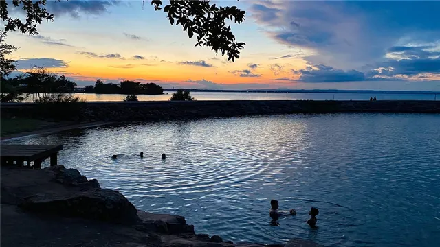 an aerial view of a golf course with parking space