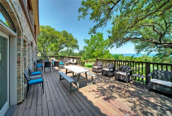 a view of a balcony with wooden floor