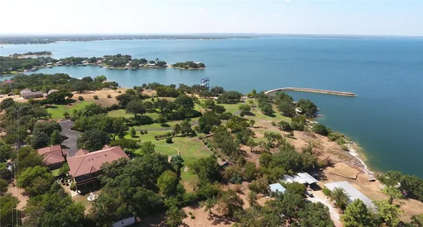 an aerial view of a golf course with parking space