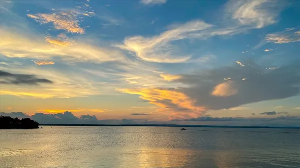 a view of a ocean next to a beach