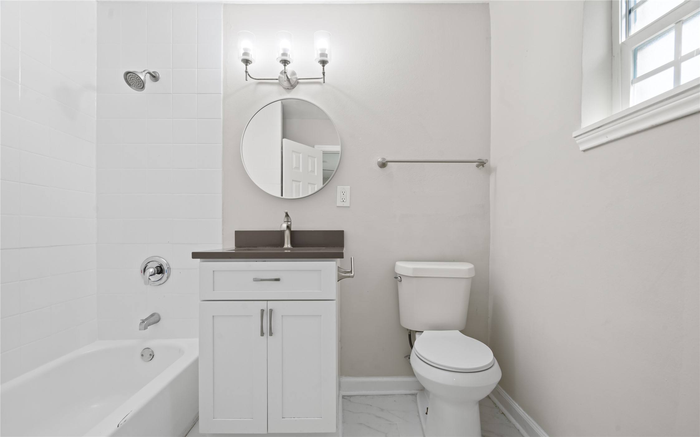 6810 Del Rio Street, Unit 4 Houston, TX 77021 - Photo 9 of 12 a bathroom with a toilet sink and mirror