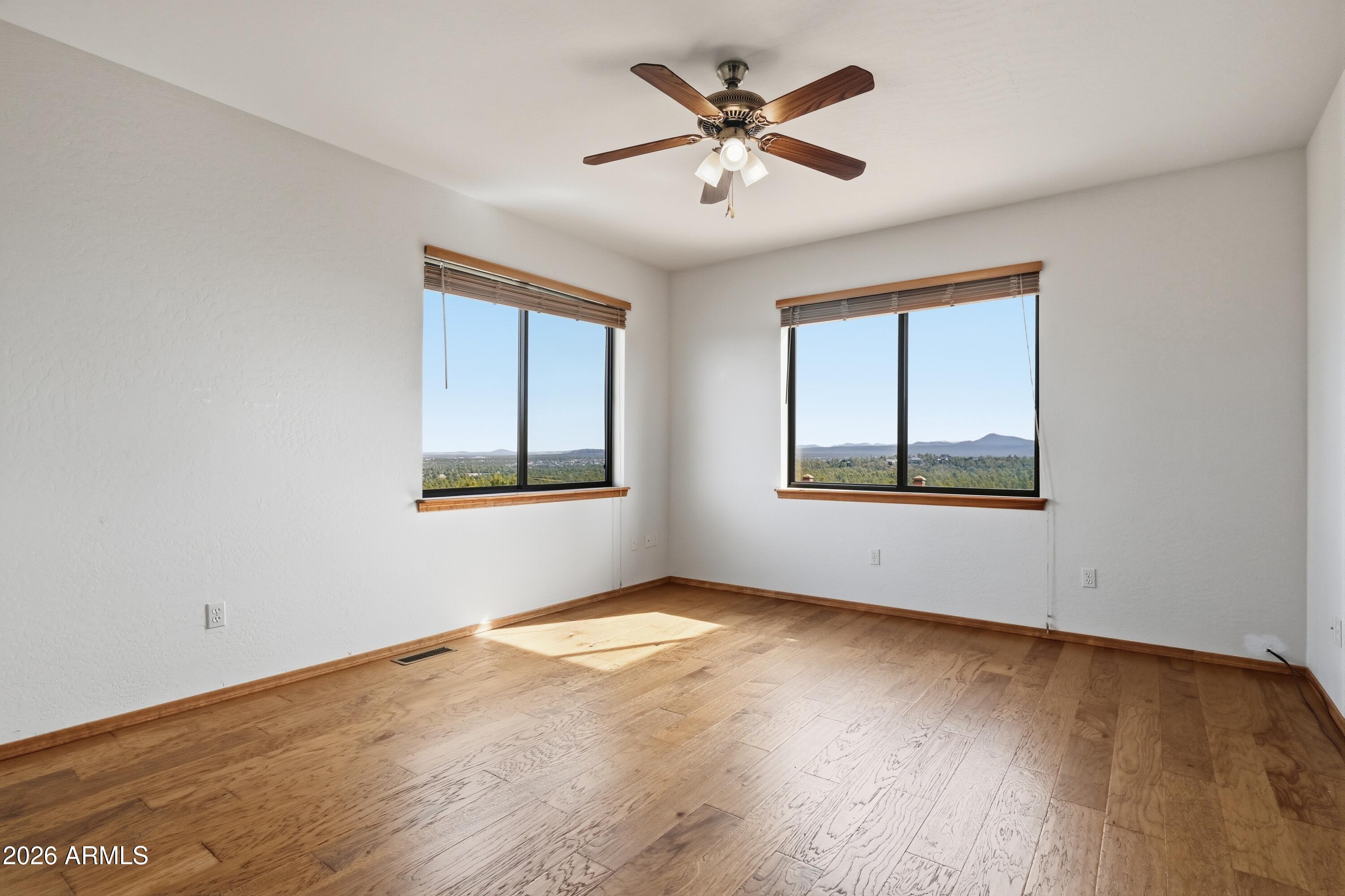 1561 South Canyon Ridge Trail Show Low, AZ 85901 - Photo 26 of 61 a view of an empty room window and wooden floor