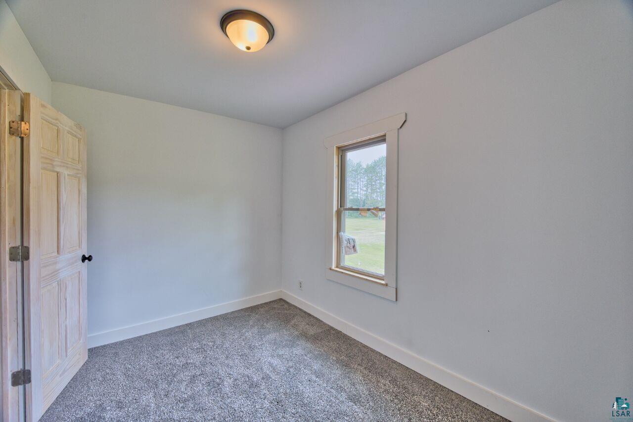 4755 Judd Road Gilbert, MN 55741 - Photo 13 of 50 Unfurnished room featuring carpet flooring and baseboards