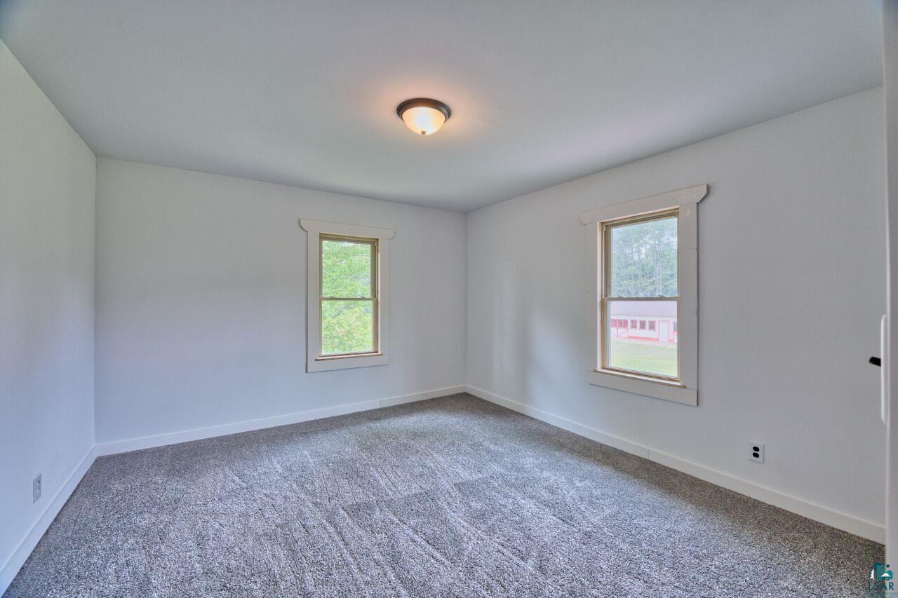 4755 Judd Road Gilbert, MN 55741 - Photo 18 of 50 Carpeted spare room featuring baseboards