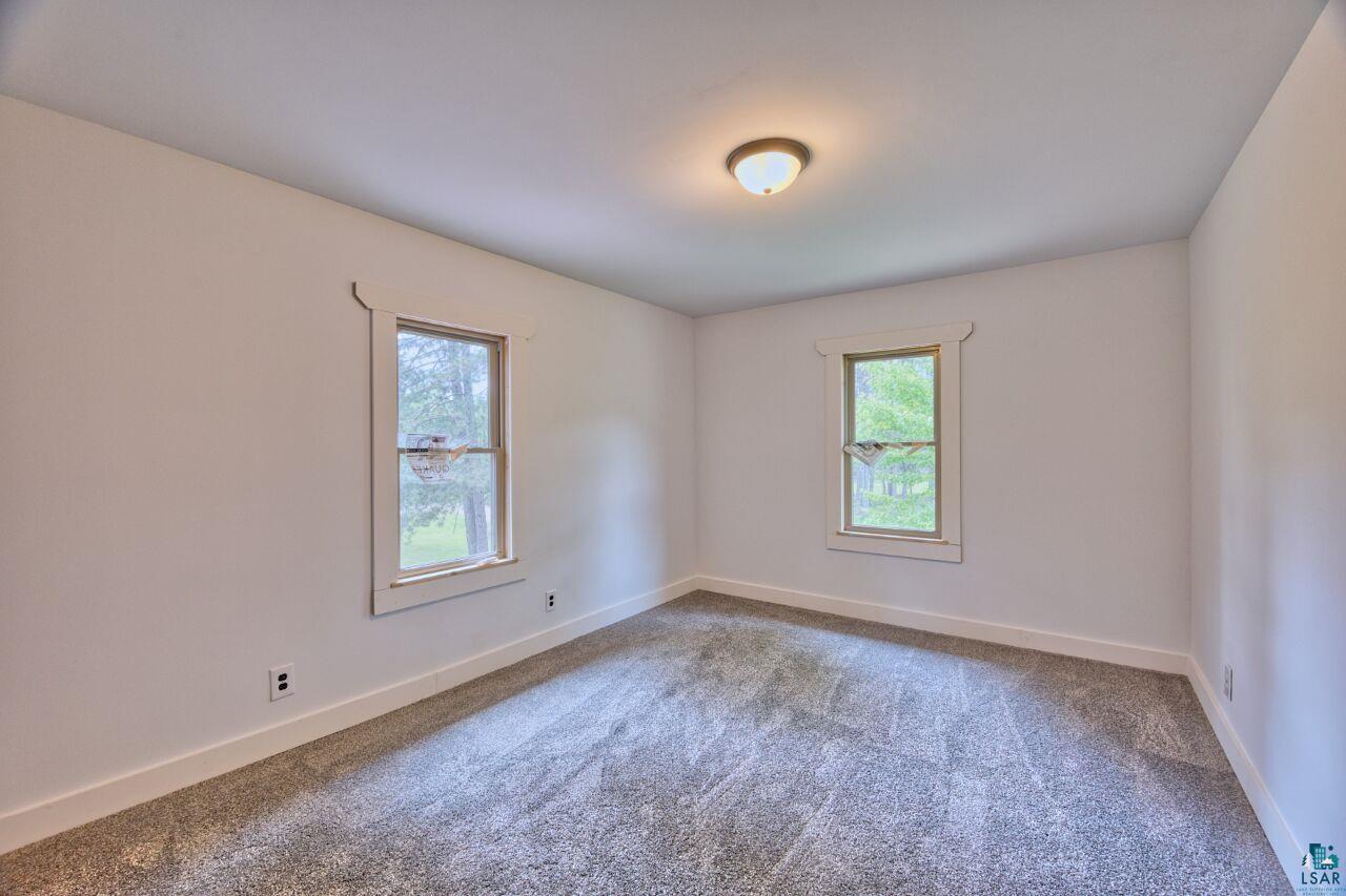 4755 Judd Road Gilbert, MN 55741 - Photo 20 of 50 Carpeted empty room featuring baseboards