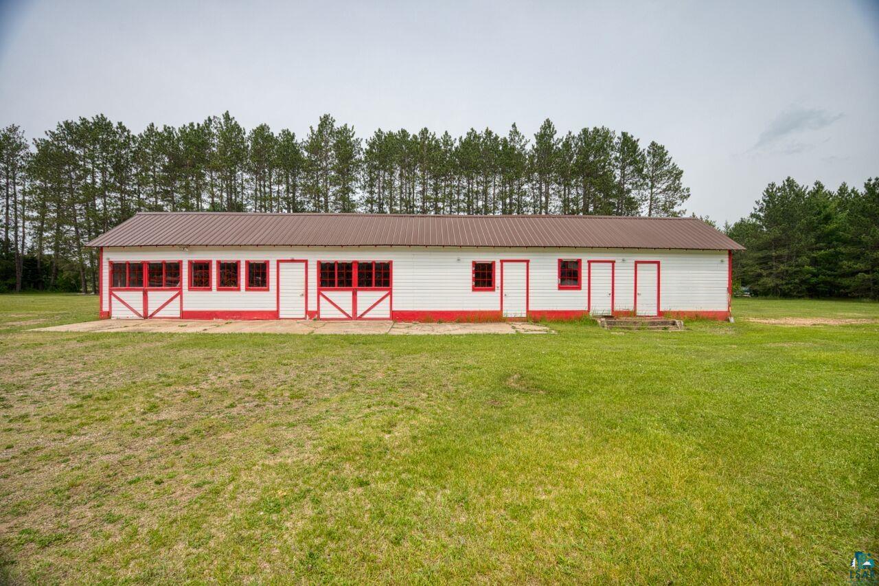 4755 Judd Road Gilbert, MN 55741 - Photo 28 of 50 View of front of house featuring a front yard, an outbuilding, and metal roof