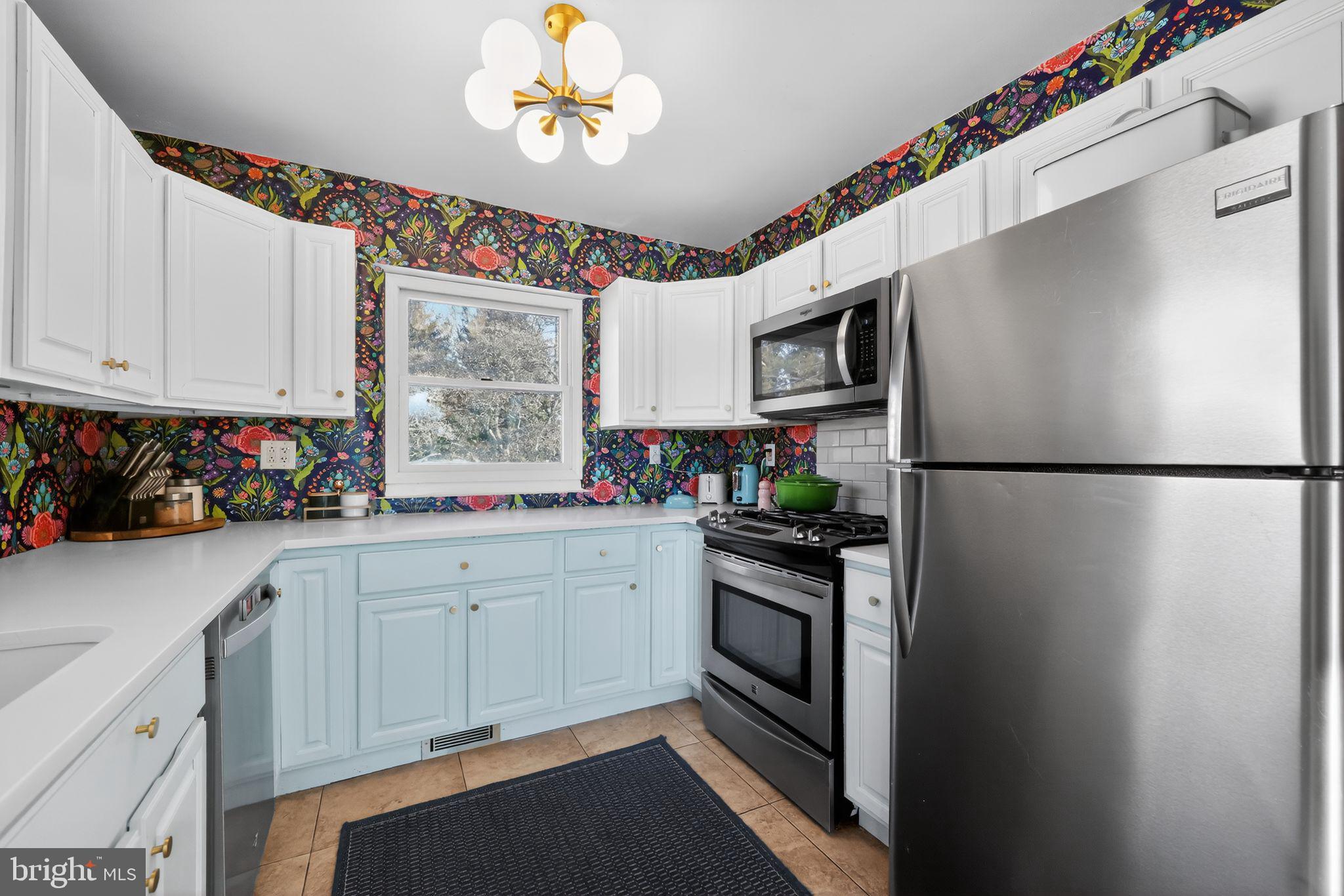 711 Brookhaven Road Wallingford, PA 19086 - Photo 11 of 35 a kitchen with a refrigerator and a sink