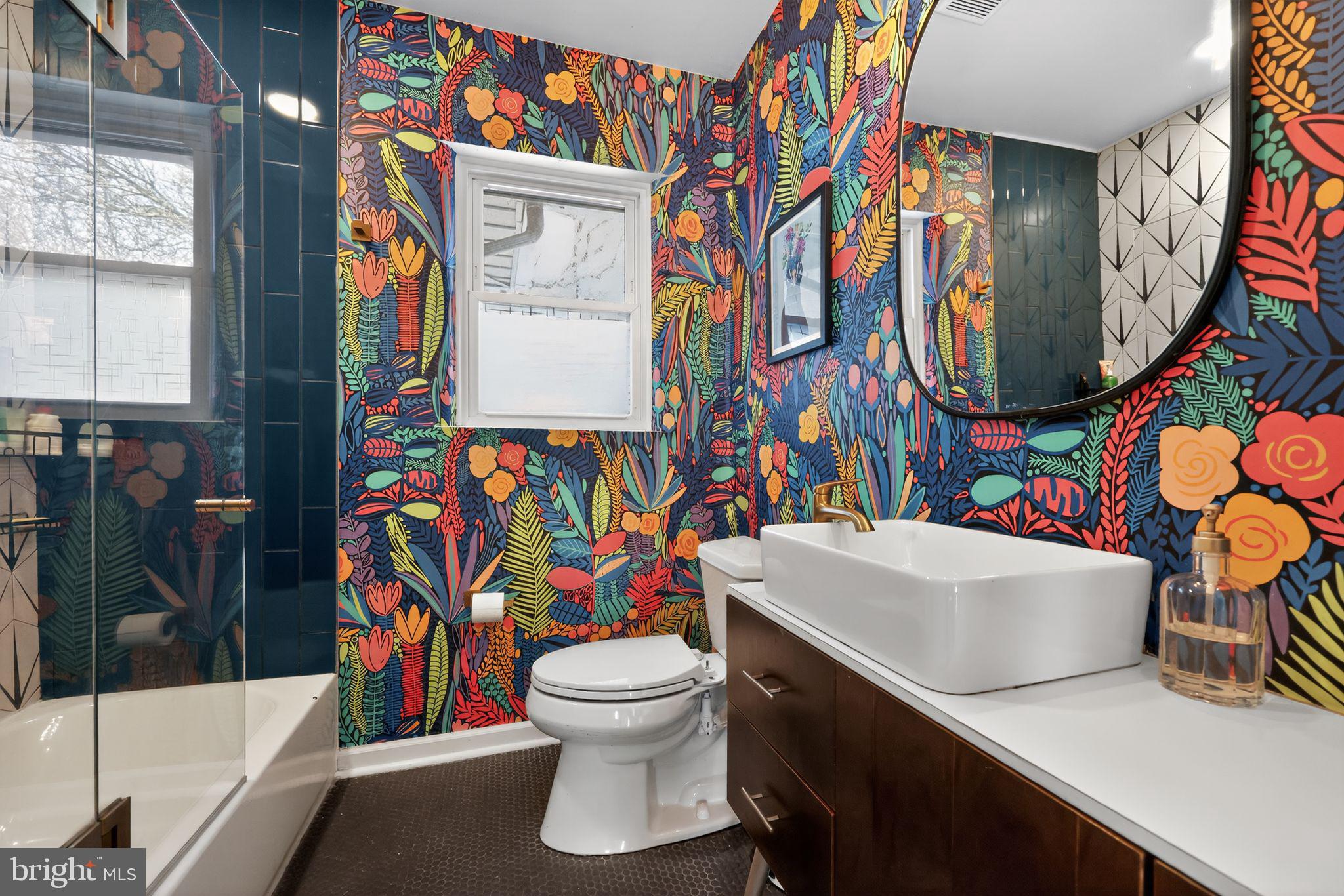 711 Brookhaven Road Wallingford, PA 19086 - Photo 14 of 35 a bathroom with a sink a toilet and shower curtain