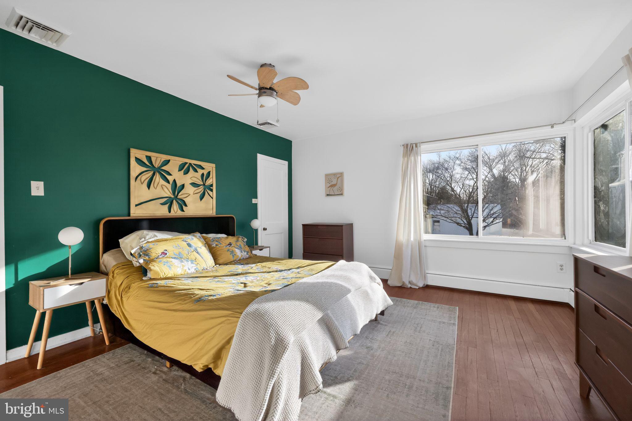 711 Brookhaven Road Wallingford, PA 19086 - Photo 17 of 35 a bedroom with a bed and a large window