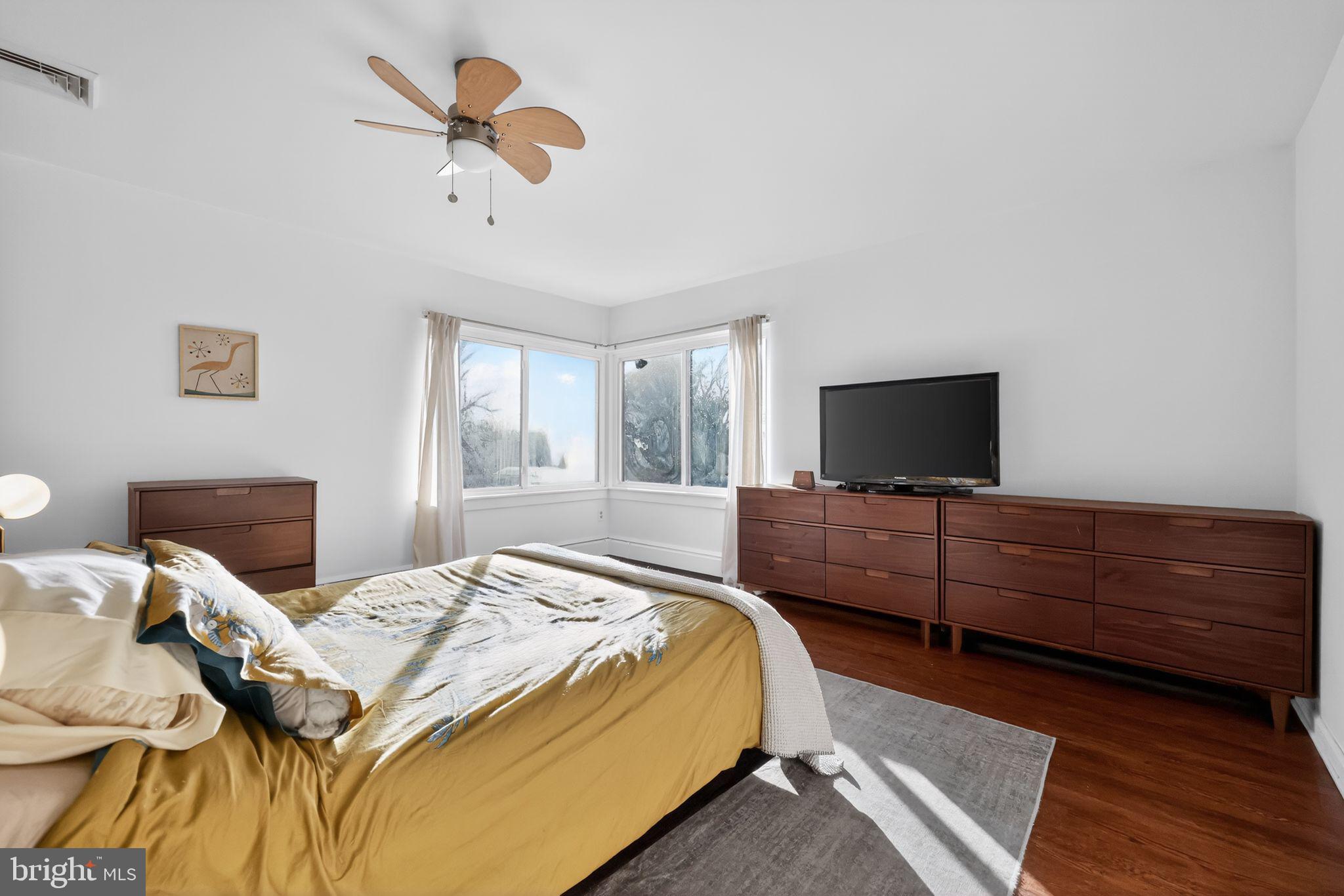 711 Brookhaven Road Wallingford, PA 19086 - Photo 18 of 35 a bedroom with a bed and a flat screen tv