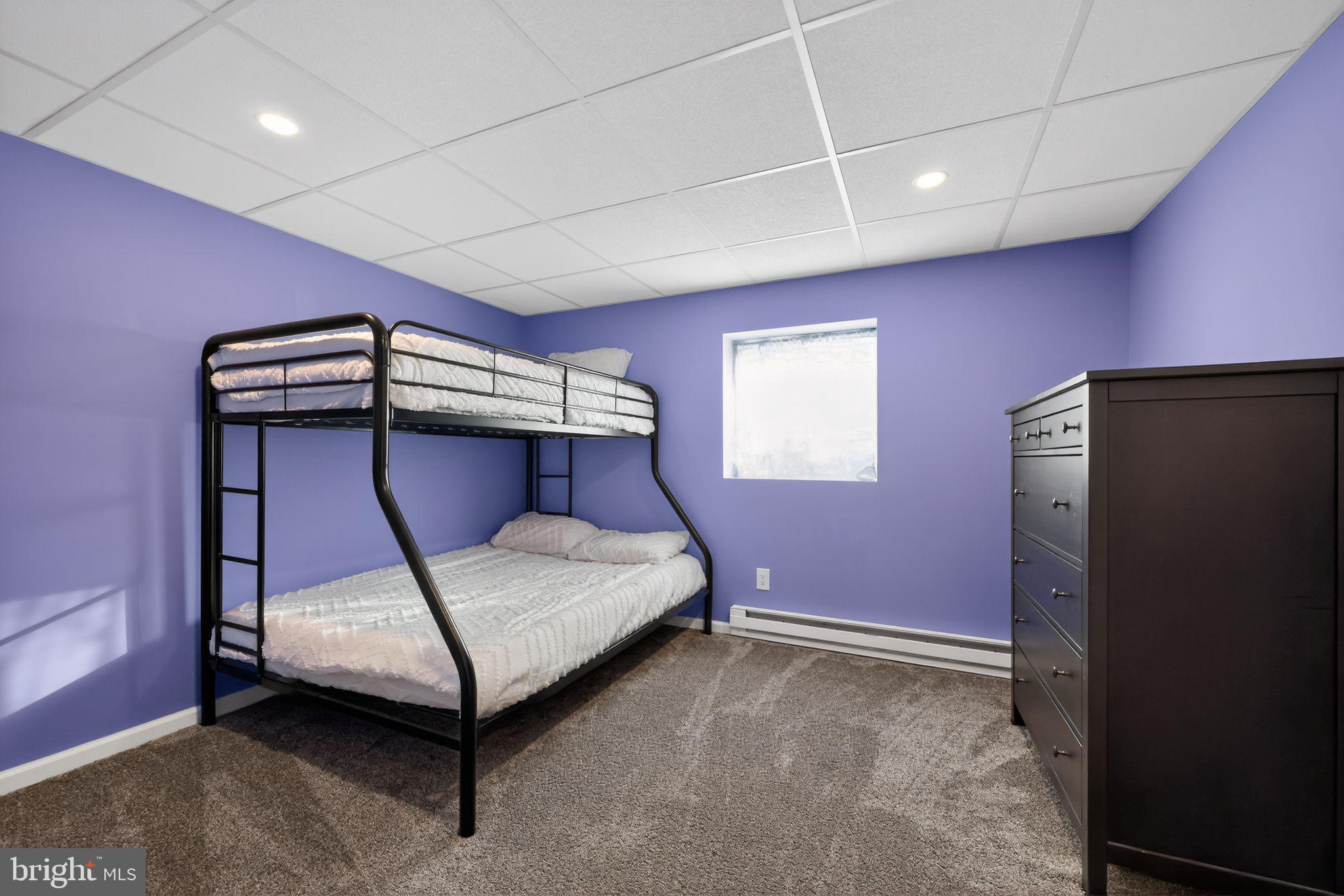 711 Brookhaven Road Wallingford, PA 19086 - Photo 31 of 35 a bedroom with a bed and a mirror